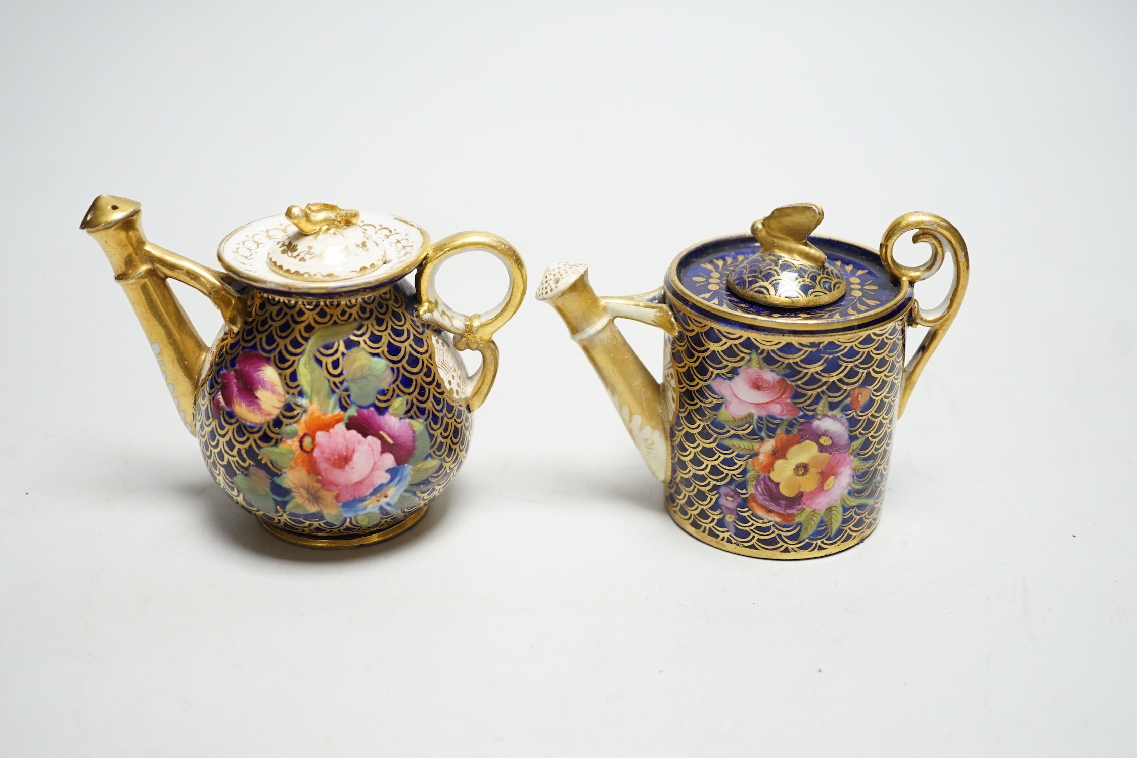 Toy porcelain: Two English rosewater scale ground sprinklers, c.1815-20, possibly Coalport, each modelled in the form of a watering can